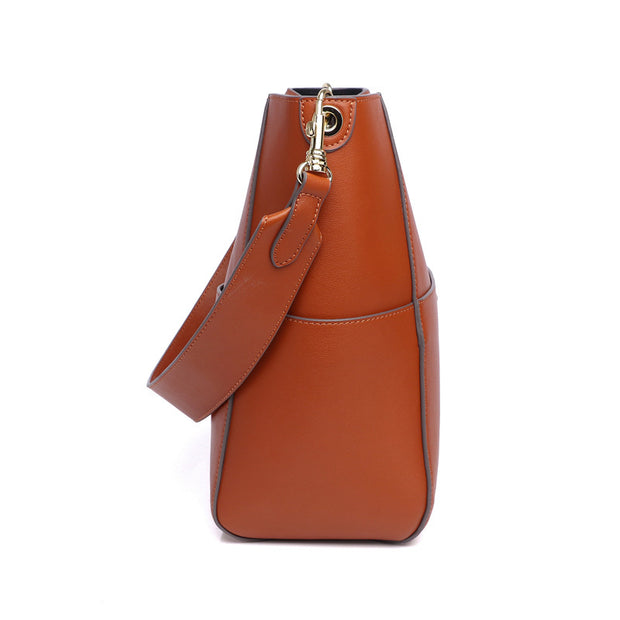 Side view of brown leather bucket bag