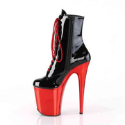 Side view of black and red high heel boots