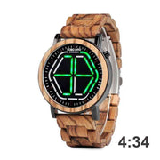 Wooden watch with green LED display at 4:34