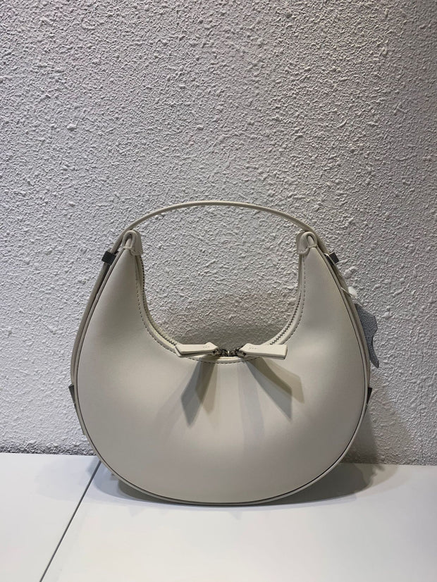 White crescent leather bag with bow detail