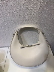 White crescent leather small bag on white surface