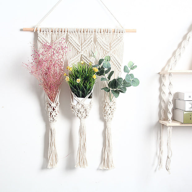 Bohemian tapestry rack with flowers and greenery