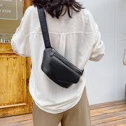 Black waist bag worn crossbody style