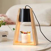 Japanese-style wood melting candle night light with a black shade illuminating a scented candle, creating a warm ambiance.