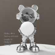 Silver plated bear with white sphere