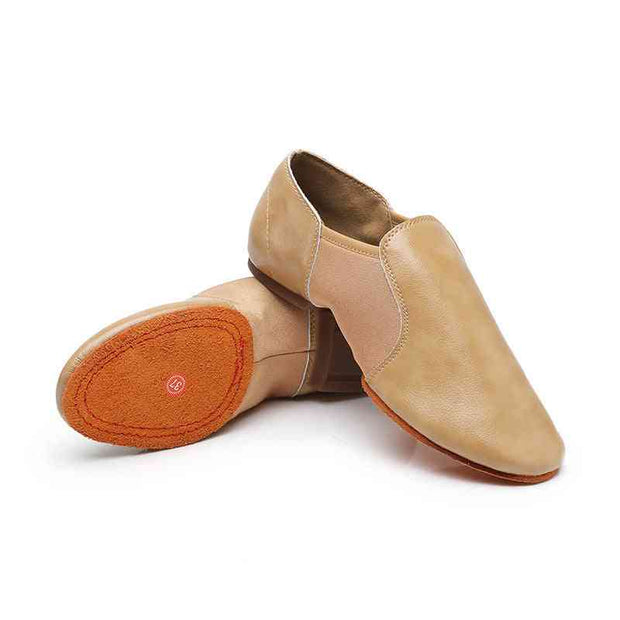 Pair of beige leather dance training shoes