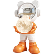 Orange astronaut bear holding moon lamp