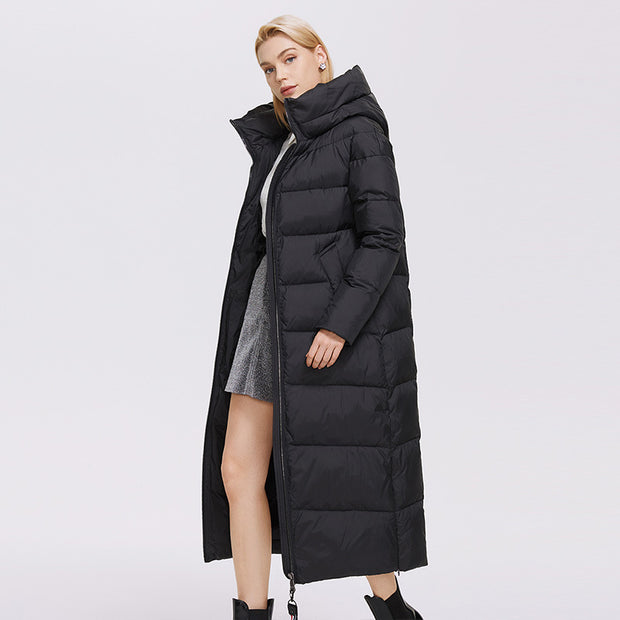 Model in long black puffer jacket with open front