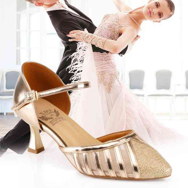 Gold dance shoe with medium heel in ballroom setting