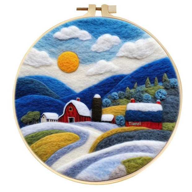 Snowy landscape wool felt painting with barns and hills