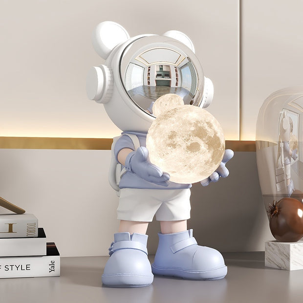 Light blue space bear with moon lamp on desk