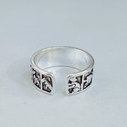 Close-up of adjustable silver zodiac ring