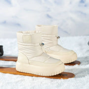 Beige retro snow boots on snow with skis