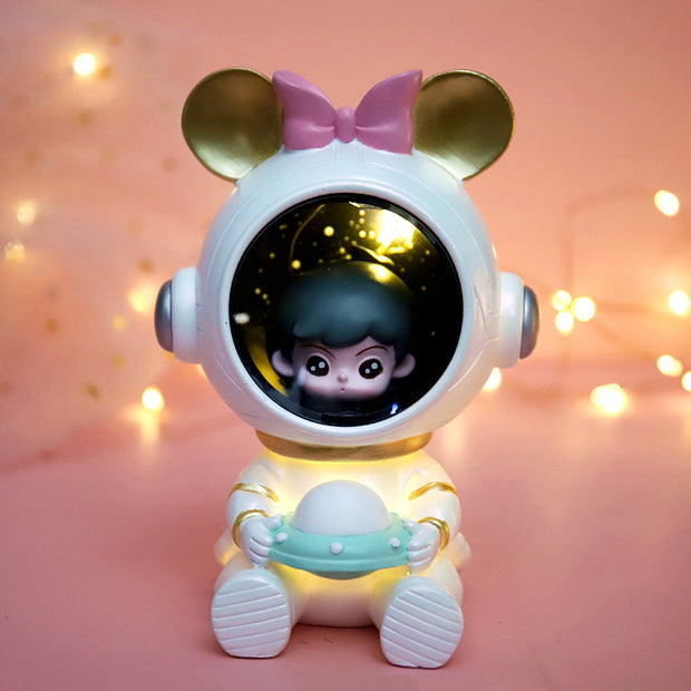 Children's star light with a mouse-themed design, pink bow, and glowing UFO, creating a playful and cozy atmosphere.