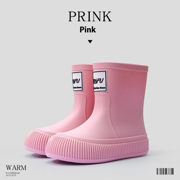 Pink platform rain boots with logo detail