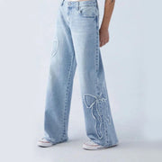 Light blue embroidered side frayed jeans with bow detail