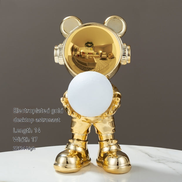 Gold electroplated bear with white sphere