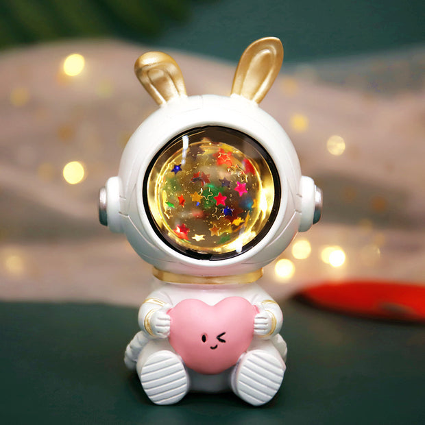 Children's star light with a bunny-themed design, golden ears, and glowing starry globe, creating a magical nighttime ambiance.