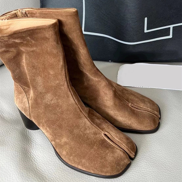 Brown suede split toe women's boots on display