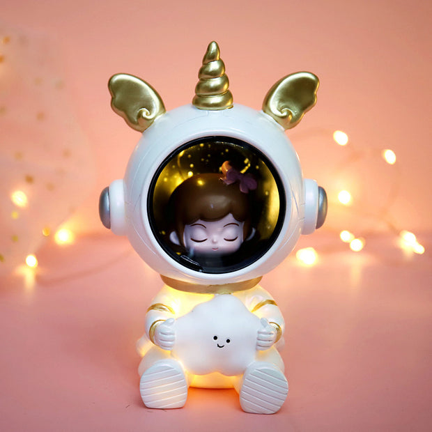 Children's star light featuring a unicorn-themed design with golden accents, holding a glowing cloud, creating a dreamy atmosphere.