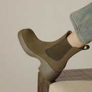 Side view of olive suede Chelsea boot