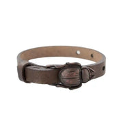 Scarab buckle bracelet in brown leather featuring a copper-tone scarab design, ideal for versatile styling.