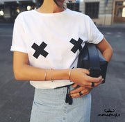 Person with leather band ring holding black bag