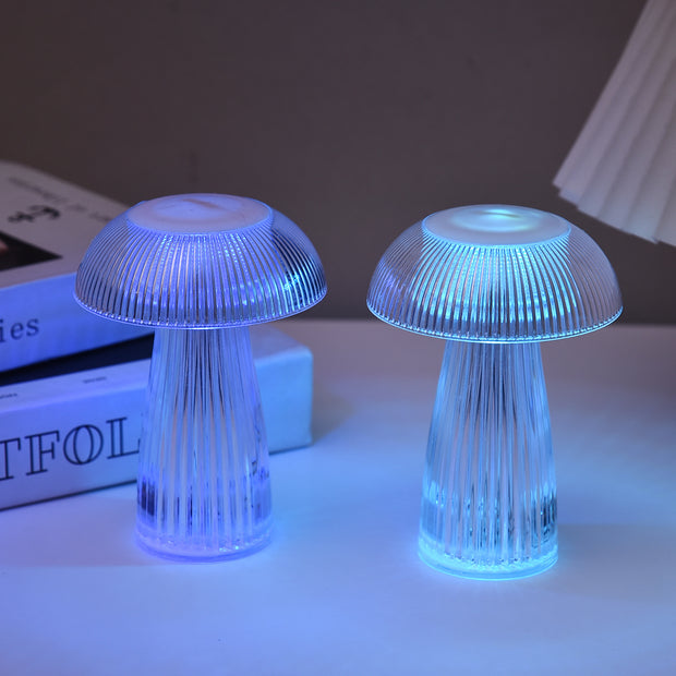 Two electronic mushroom lamps emitting colorful light