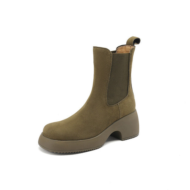 Single olive suede Chelsea boot on white background