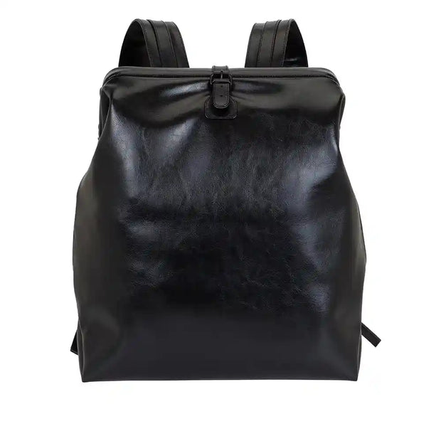 Black leather backpack with a vintage design, featuring a sleek and minimalist exterior, crafted from genuine leather.